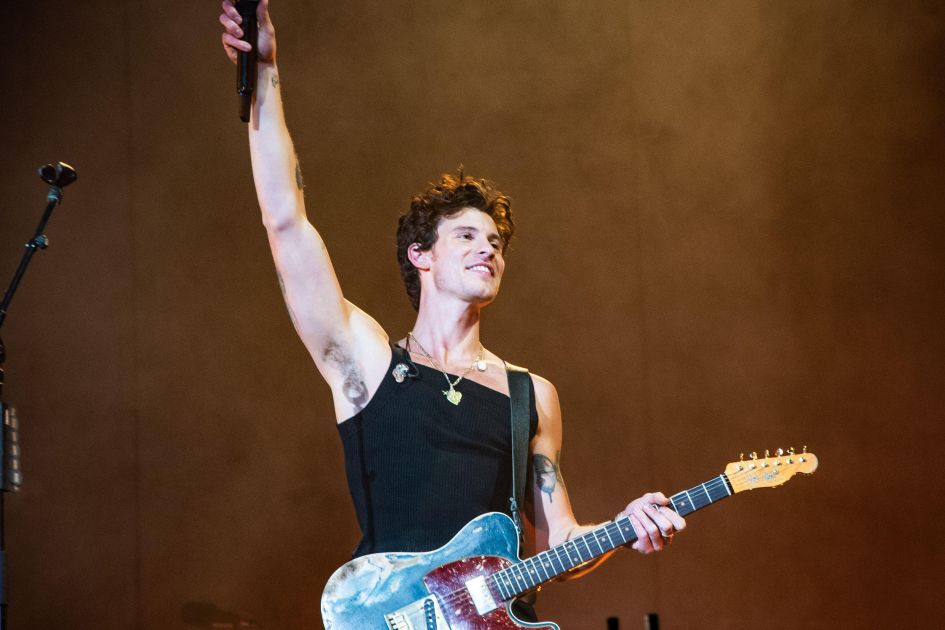 Shawn Mendes blessed by a priest at concert