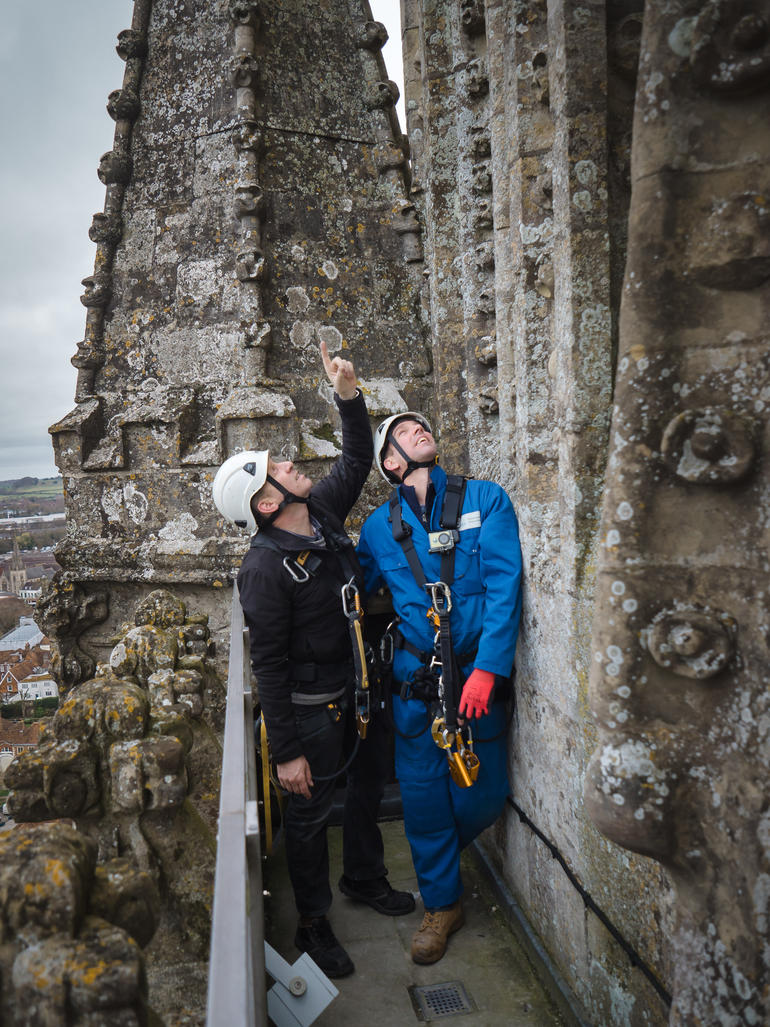 Pair scale Salisbury spire to change light bulbs