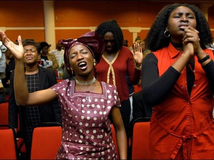 Black women worship church.jpg