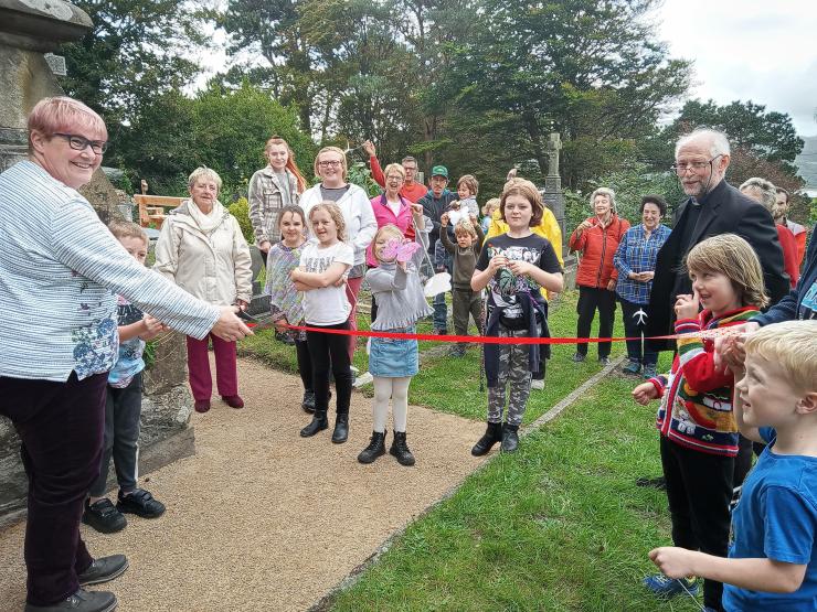 Councillor Meryl Roberts and Reverend Roland Barnes with children of the Saturday Club at opening of the Tranquillity Garden.jpg