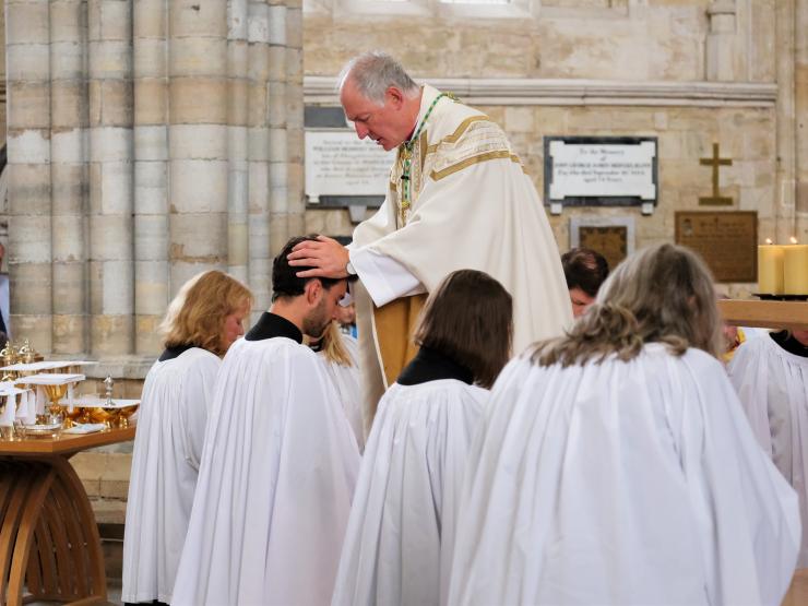 Ordinations 2022 Bishop lays hands on Rev'd Daniel Miles.JPG