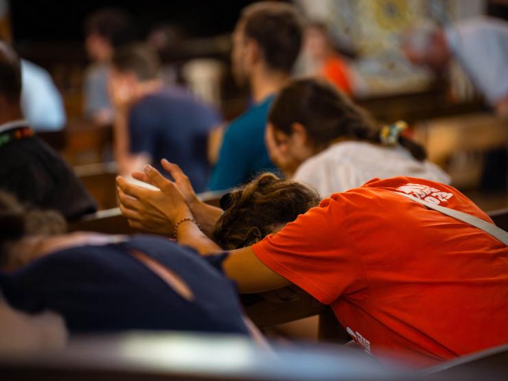 young people praying in church.jpg
