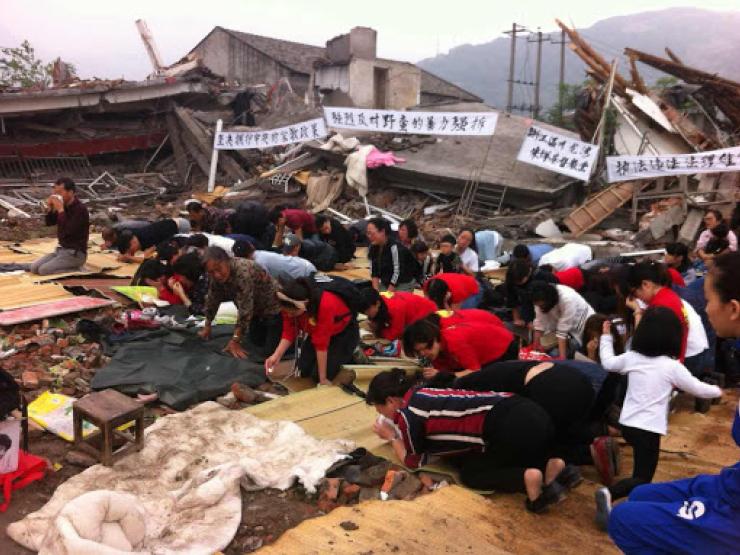 Christians worship in the rubble of their church Photo credit China Aid.jpg