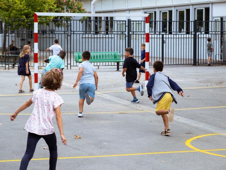 School children playing football.JPG