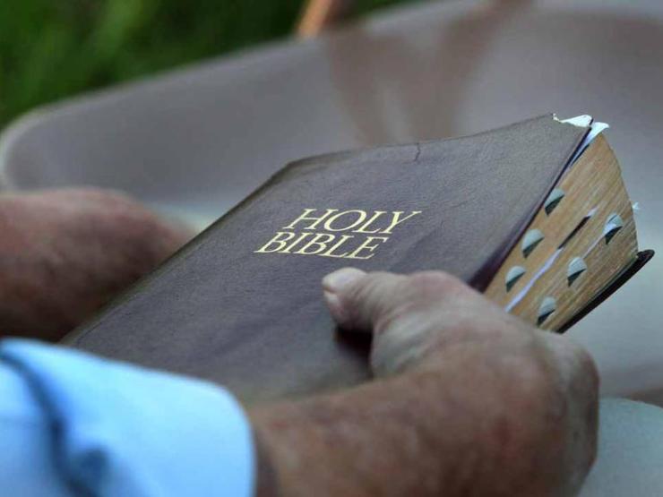 Holding-a-Bible-thumb_galleryfull.jpg