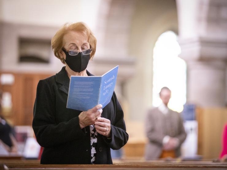 Woman mask face covering coronavirus St James The Great church in Stonehaven PA Jane Barlow.jpg