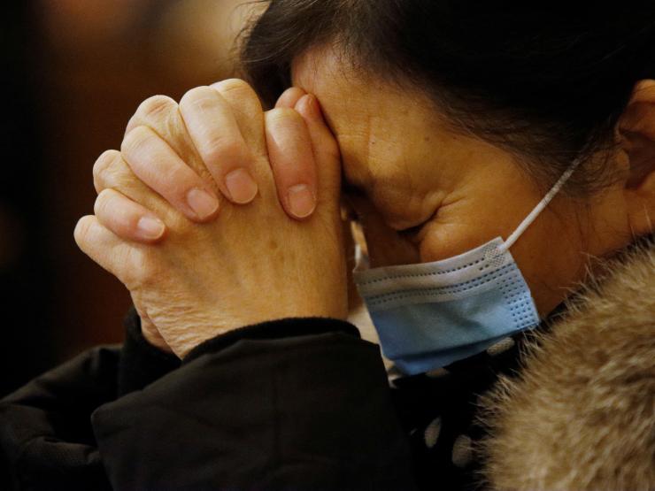 Mask wearer at church in Beijing.JPG