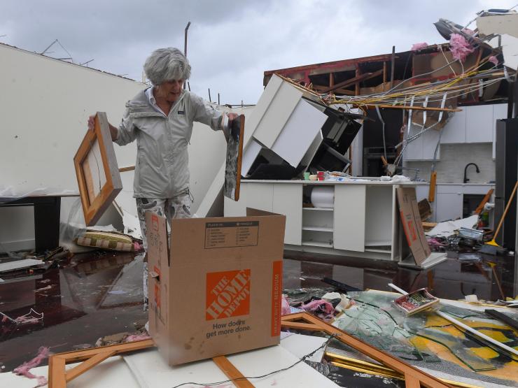 2024-10-11T144635Z_506724196_MT1USATODAY24461183_RTRMADP_3_BAYOU-WEST-RESIDENT-MARY-SINGER-82-TRIES-TO-SALVAGE-ITEMS.JPG