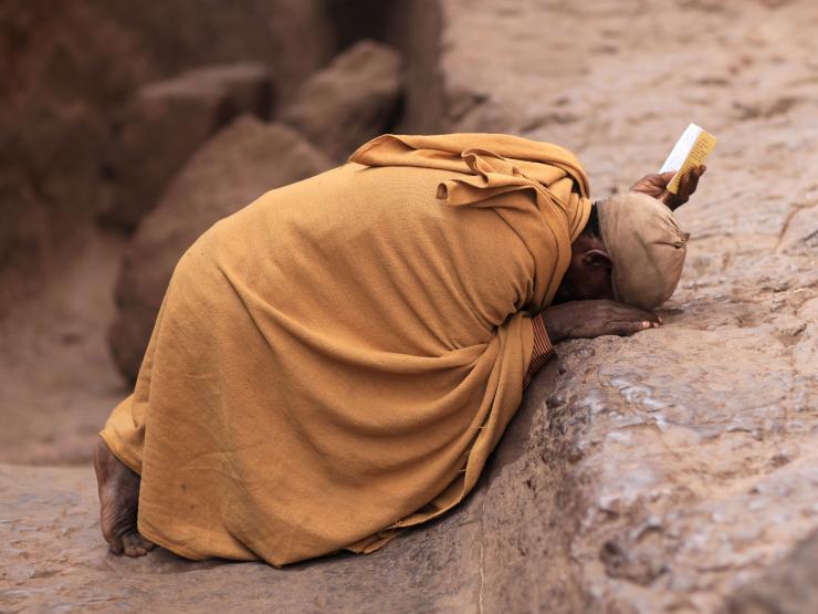 CONGO AFRICAN PRIEST PRAYING.jpg