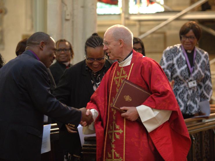 Justin wleby shaking hands racial justice .jpeg