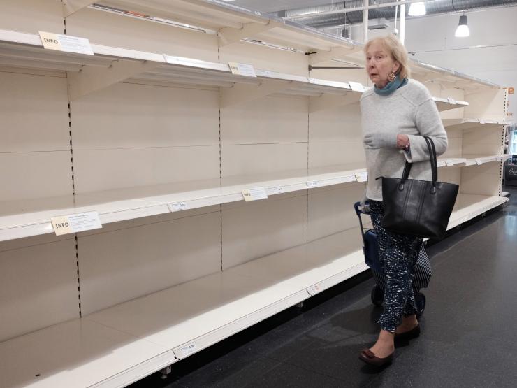 older lady empty shelves.jpg