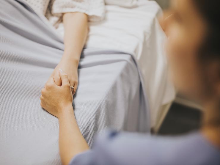 nurse-holding-her-patients-hand.jpg