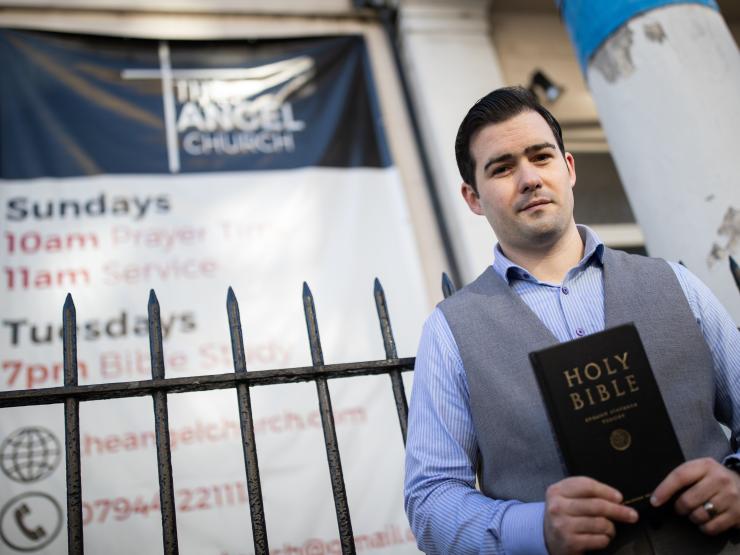 regan king holding bible angel church PA Aaron Chown.jpg