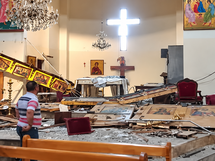 Damaged Church Sanctuary with Glowing Cross.png