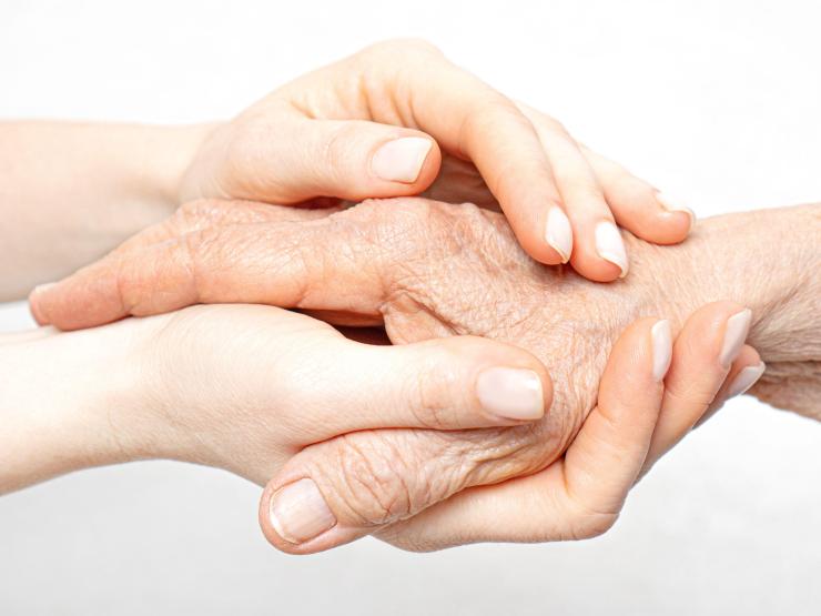 Holding hand Alamy.jpg